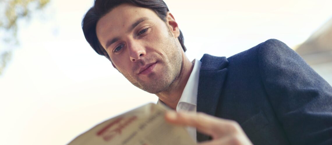 Man reading newspaper
